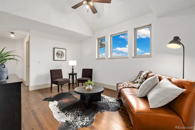 a bathroom with a sink a toilet a mirror and bathtub