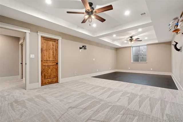 a view of a swimming pool with lawn chairs and a yard