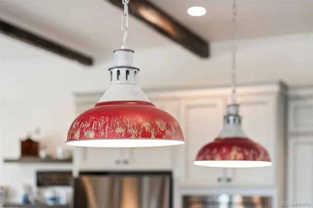 a kitchen with stainless steel appliances granite countertop a sink a stove and a granite counter tops