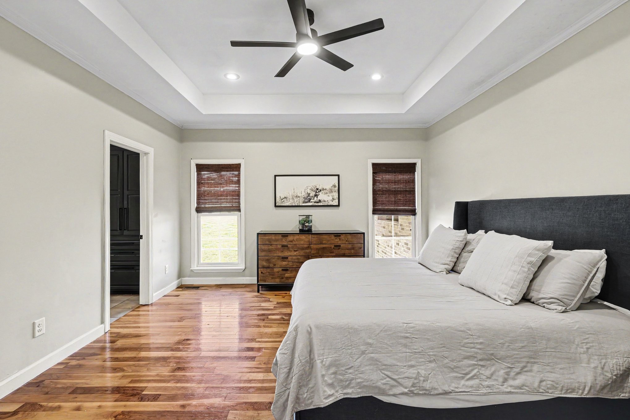 2829 Anes Station Road Lewisburg, TN 37091 - Photo 21 of 43 a bedroom with a large bed and wooden floor