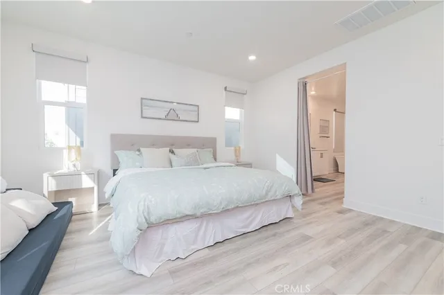 a bedroom with a bed and a couch