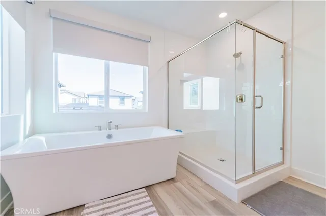 a bathroom with a bathtub and a shower