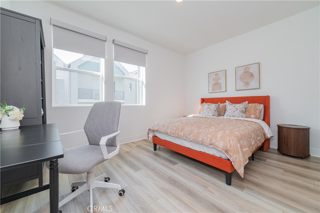 168 Sash Irvine, CA 92618 - Photo 22 of 31 a bedroom with a bed and wooden floor