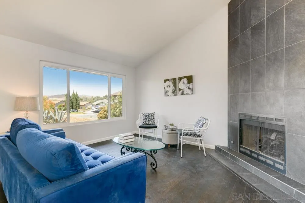 2515 Trace Road Spring Valley, CA 91978 - Photo 1 of 25 a living room with furniture and a fireplace