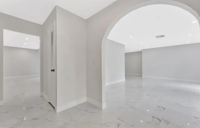 an empty room with a bathroom