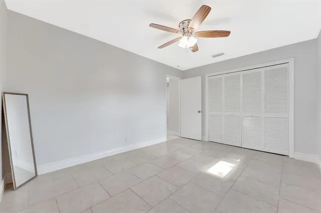a bathroom with a granite countertop sink and mirror
