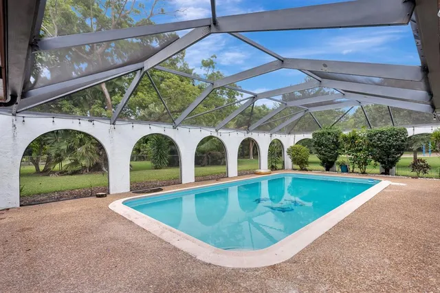 an aerial view of a house with a garden