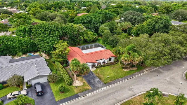 an aerial view of a house with a yard