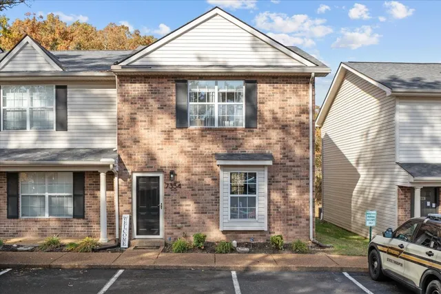 a front view of a house with parking area