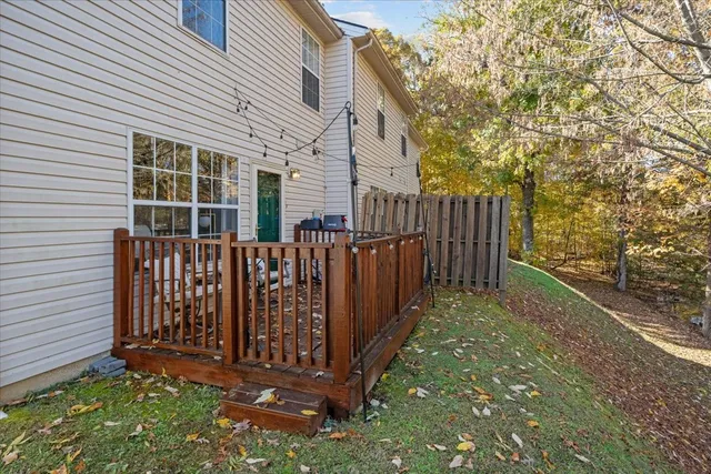 a view of a house with wooden fence