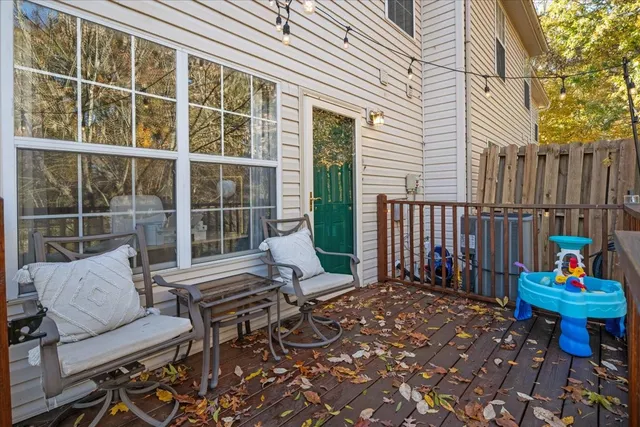 a view of a balcony with wooden fence