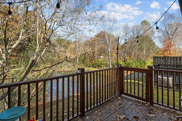a view of house with a yard and sitting area