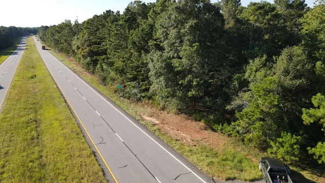 a view of balcony with yard
