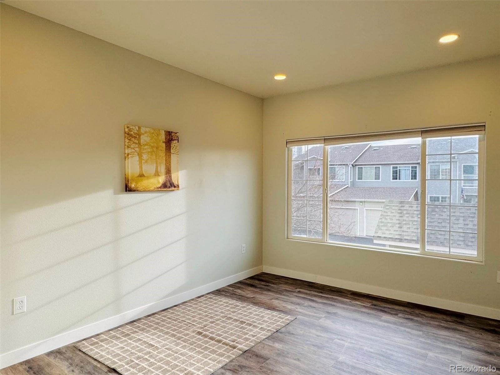 8468 South Thunder Ridge Way, Unit 202 Highlands Ranch, CO 80126 - Photo 17 of 21 a view of an empty room and a window