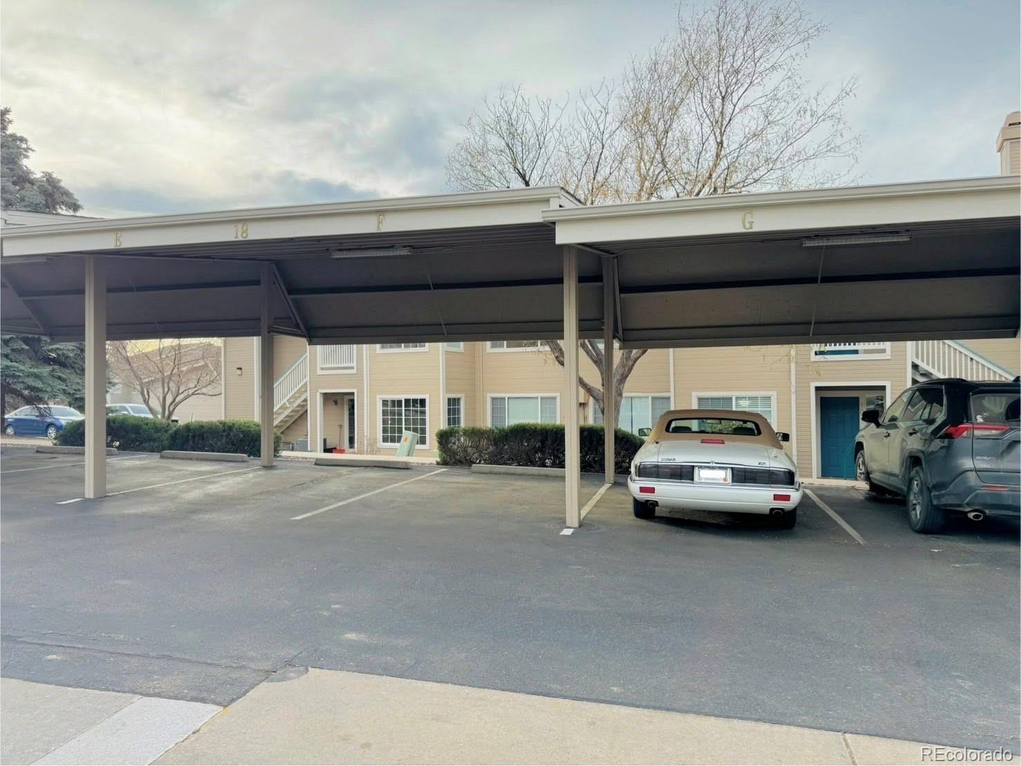 8468 South Thunder Ridge Way, Unit 202 Highlands Ranch, CO 80126 - Photo 21 of 21 a car parked in front of a building