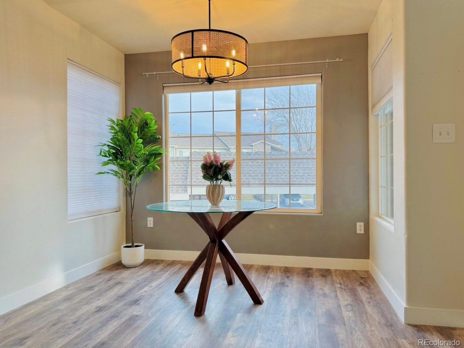 8468 South Thunder Ridge Way, Unit 202 Highlands Ranch, CO 80126 - Photo 9 of 21 a view of a room with furniture wooden floor