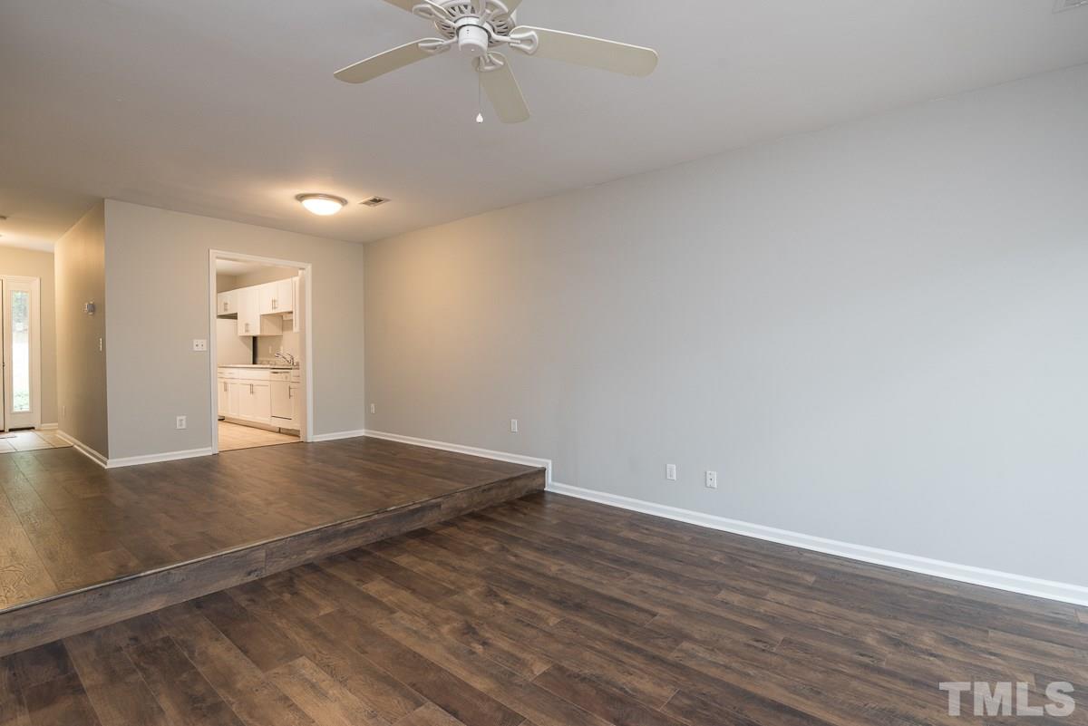 4213 Sunshadow Lane Raleigh, NC 27613 - Photo 8 of 20 wooden floor in an empty room with a window