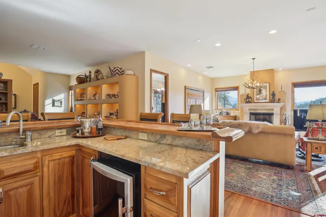 a kitchen with stainless steel appliances granite countertop a sink and stove