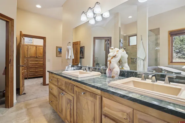 a kitchen with refrigerator cabinets and a sink
