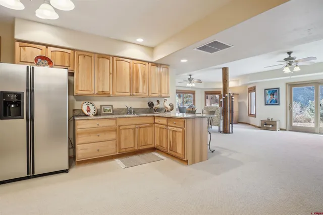 a bathroom with a shower and a sink