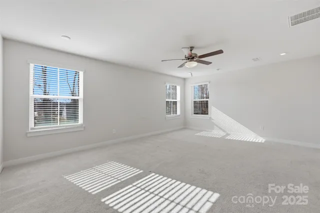 a spacious bathroom with a granite countertop sink mirror and
