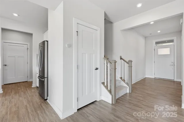 a view of entryway with wooden floor