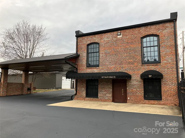 a front view of a house with a garage