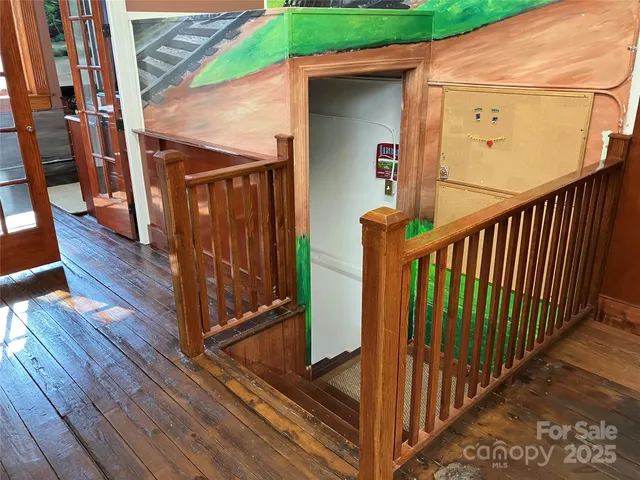 a view of a balcony with wooden floor