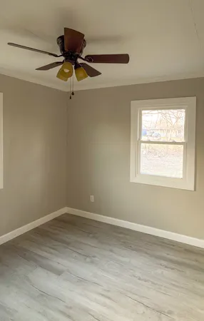a view of room window and wooden floor
