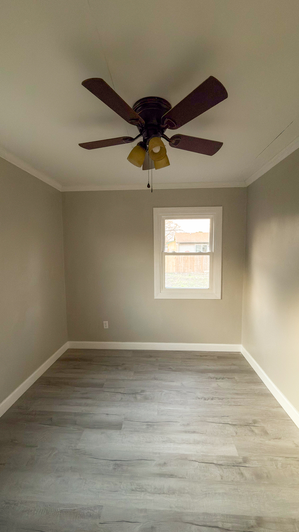 1037 Eastview Drive Rantoul, IL 61866 - Photo 17 of 21 a view of an empty room with a window