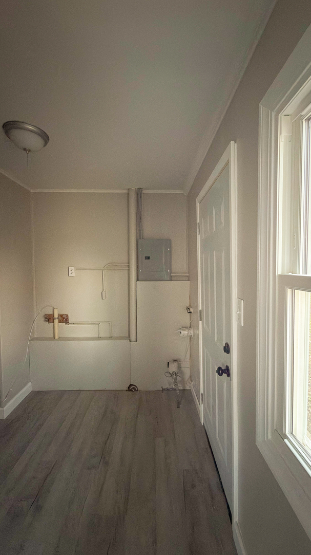 1037 Eastview Drive Rantoul, IL 61866 - Photo 7 of 21 a view of a room with a empty space and windows