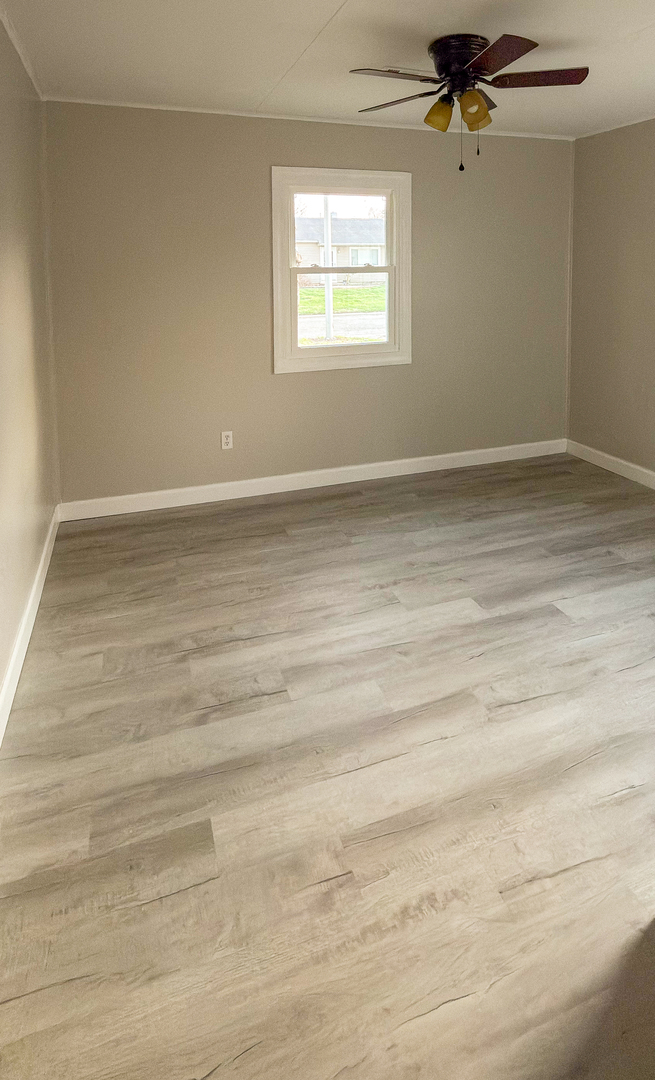1037 Eastview Drive Rantoul, IL 61866 - Photo 9 of 21 a view of an empty room with a window
