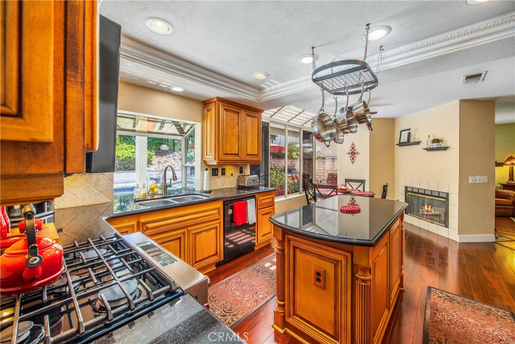 7751 Jack Rabbit Lane Highland, CA 92346 - Photo 11 of 50 a kitchen with stainless steel appliances granite countertop a sink stove and refrigerator