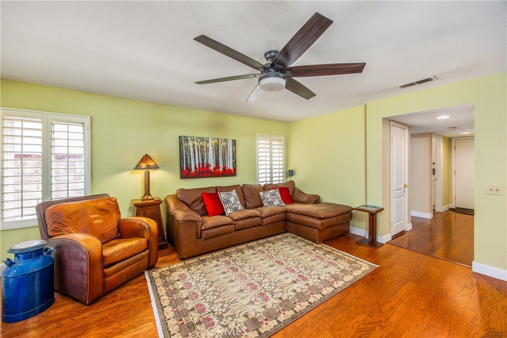 7751 Jack Rabbit Lane Highland, CA 92346 - Photo 15 of 50 a living room with furniture and a rug