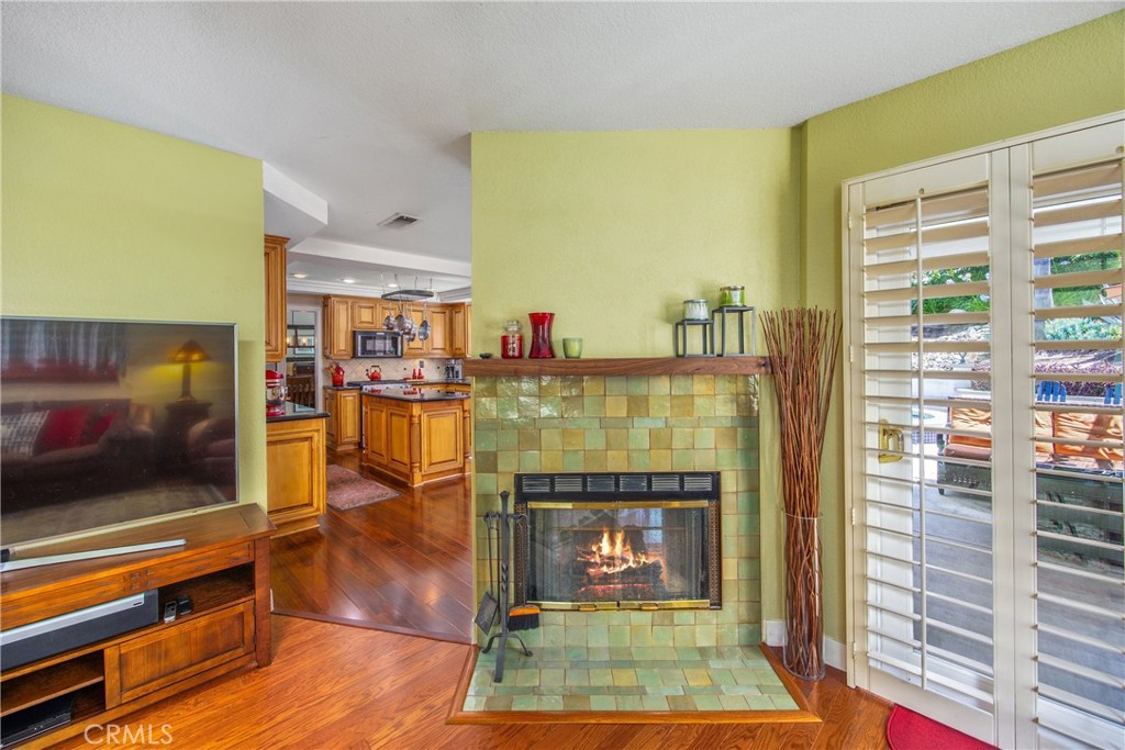 7751 Jack Rabbit Lane Highland, CA 92346 - Photo 16 of 50 a living room with fireplace furniture and a flat screen tv