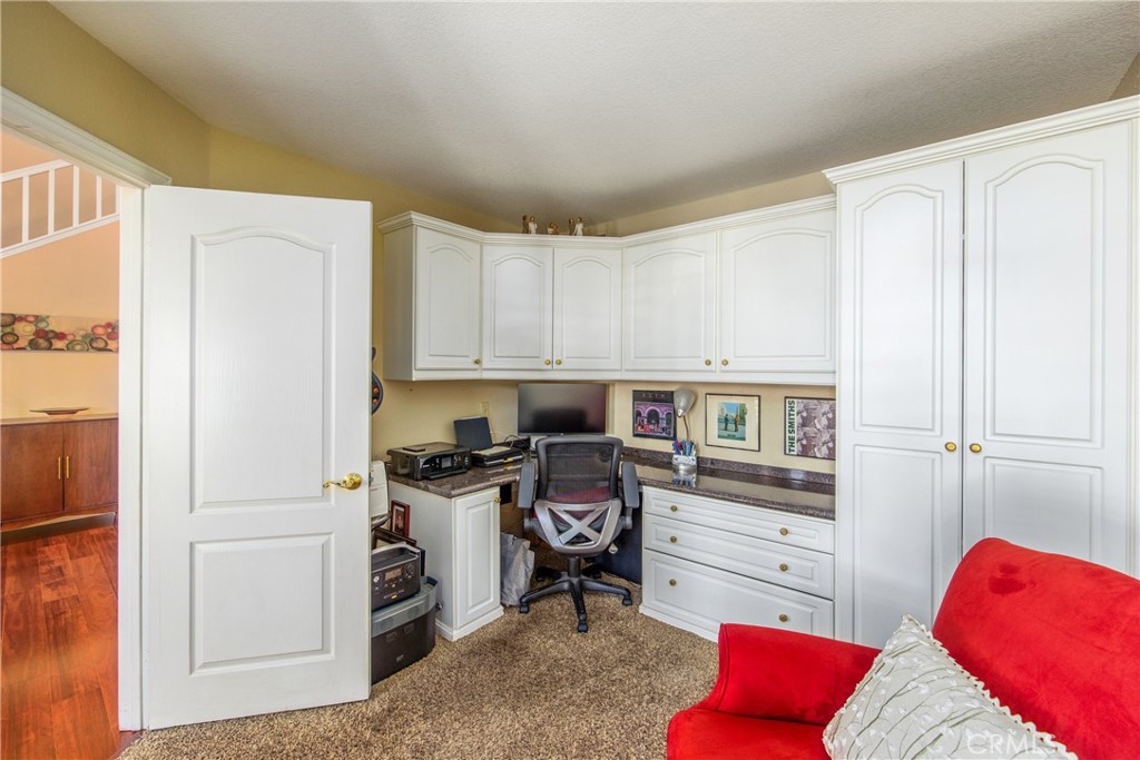 7751 Jack Rabbit Lane Highland, CA 92346 - Photo 19 of 50 a kitchen with stainless steel appliances granite countertop a refrigerator and a stove top oven