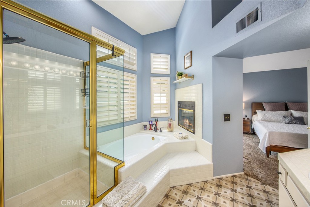 7751 Jack Rabbit Lane Highland, CA 92346 - Photo 29 of 50 a spacious bathroom with a tub and shower