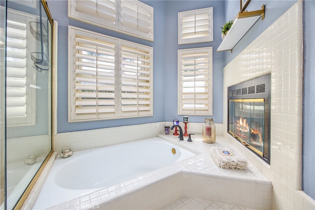 7751 Jack Rabbit Lane Highland, CA 92346 - Photo 34 of 50 a white bath tub sitting in a bathroom next to a window
