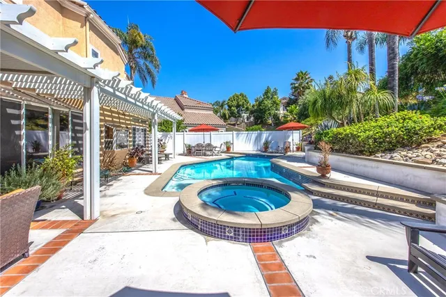 a view of a swimming pool with a patio