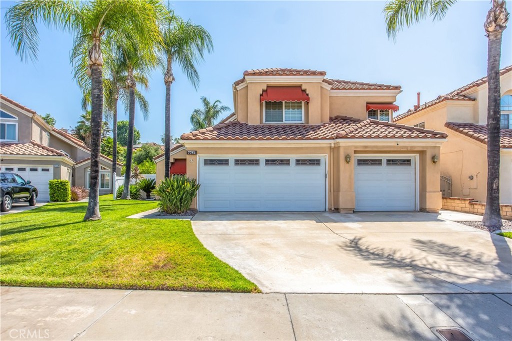 7751 Jack Rabbit Lane Highland, CA 92346 - Photo 46 of 50 a front view of a house with a garden and palm trees
