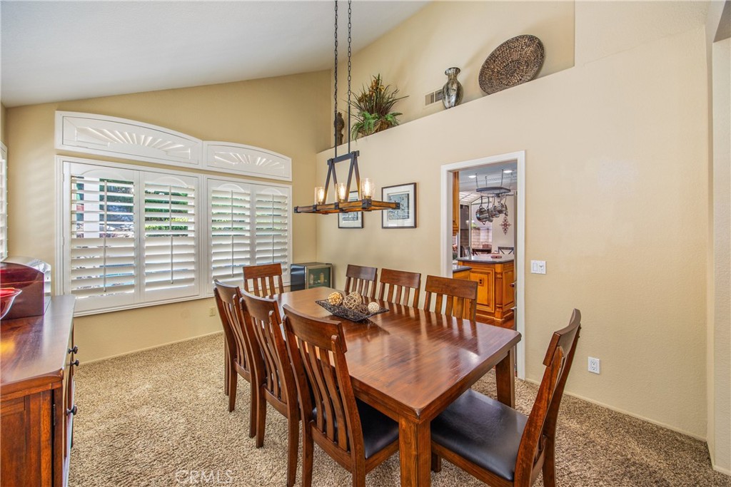 7751 Jack Rabbit Lane Highland, CA 92346 - Photo 9 of 50 a view of a dining room and livingroom with furniture window and wooden floor