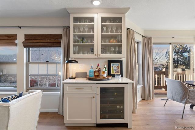 a kitchen with a stove a sink and a refrigerator