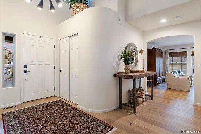 a view of a livingroom with furniture and hardwood floor