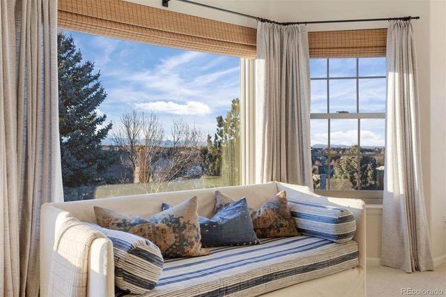 a living room with couch and a window