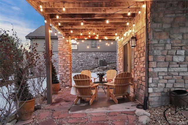a outdoor living space with patio furniture and a fireplace