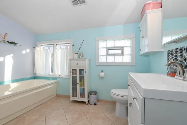 a bathroom with a sink a toilet and a bathtub