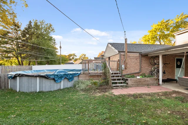 a view of a backyard with sitting area