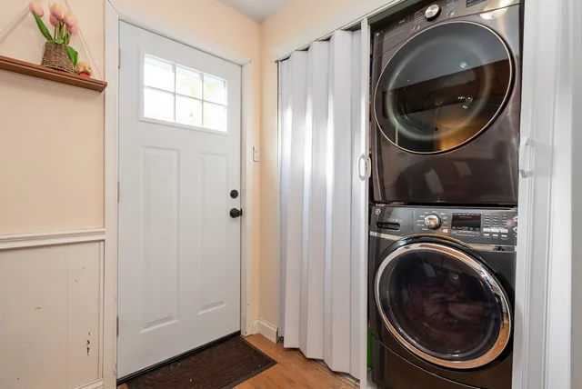 a view of a hallway with washer and dryer