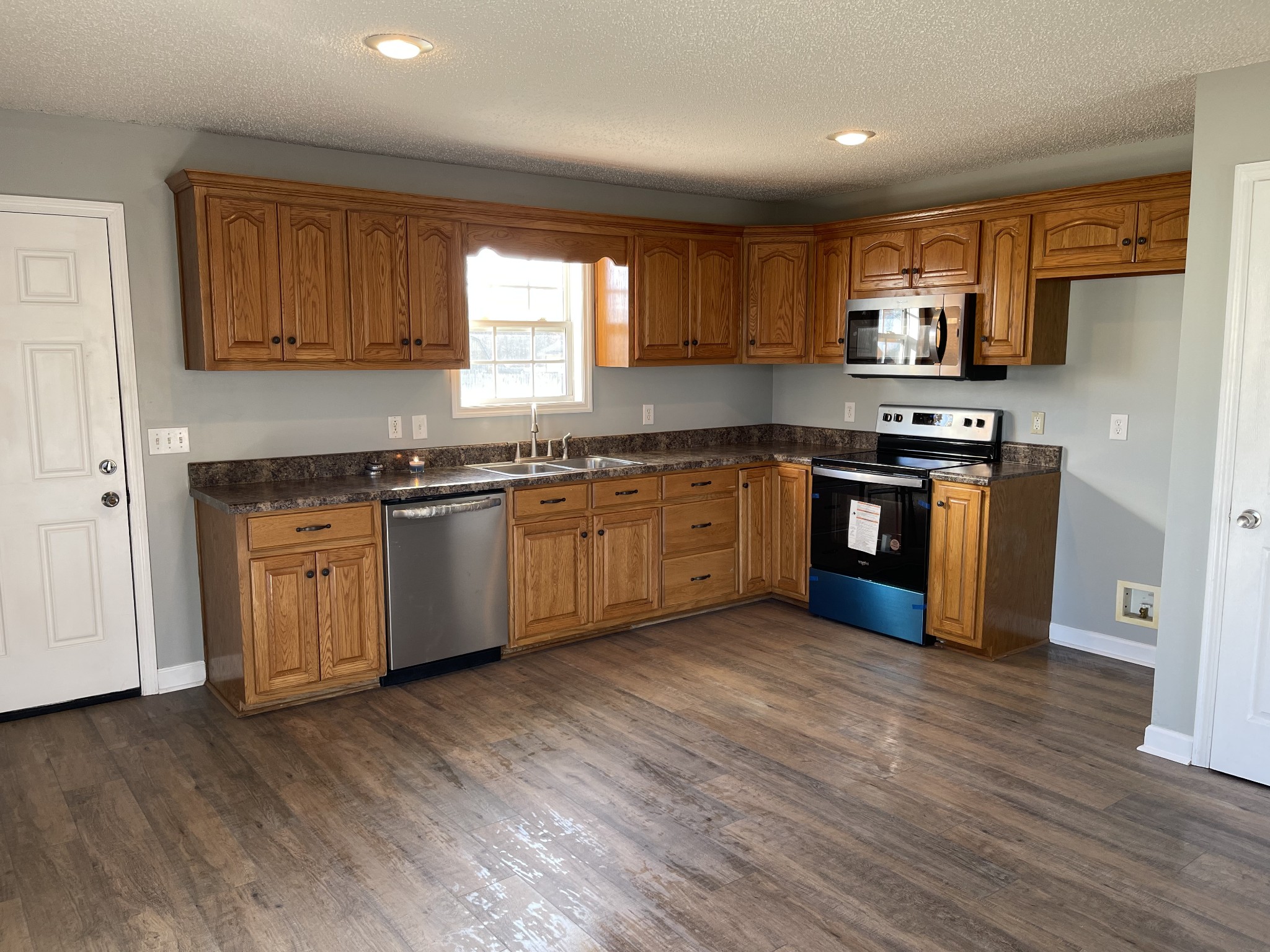 274 Johns Cemetery Road Pulaski, TN 38478 - Photo 3 of 13 a kitchen with stainless steel appliances granite countertop a stove a sink dishwasher and a refrigerator