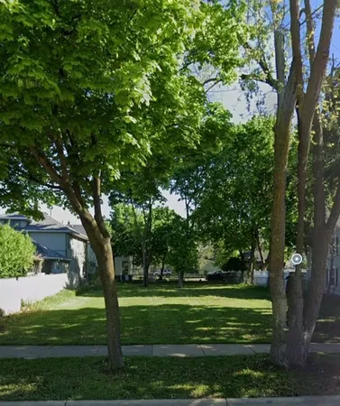 a garden view with a fountain